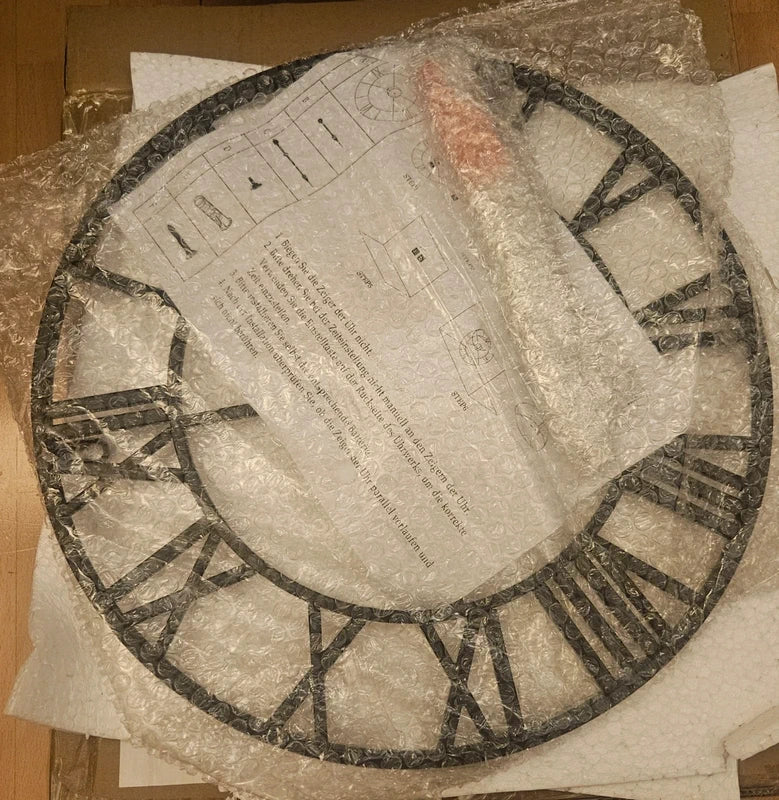 Reloj de pared redondo metal negro calado