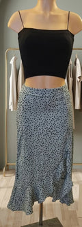 Falda midi verde agua con lunares negros